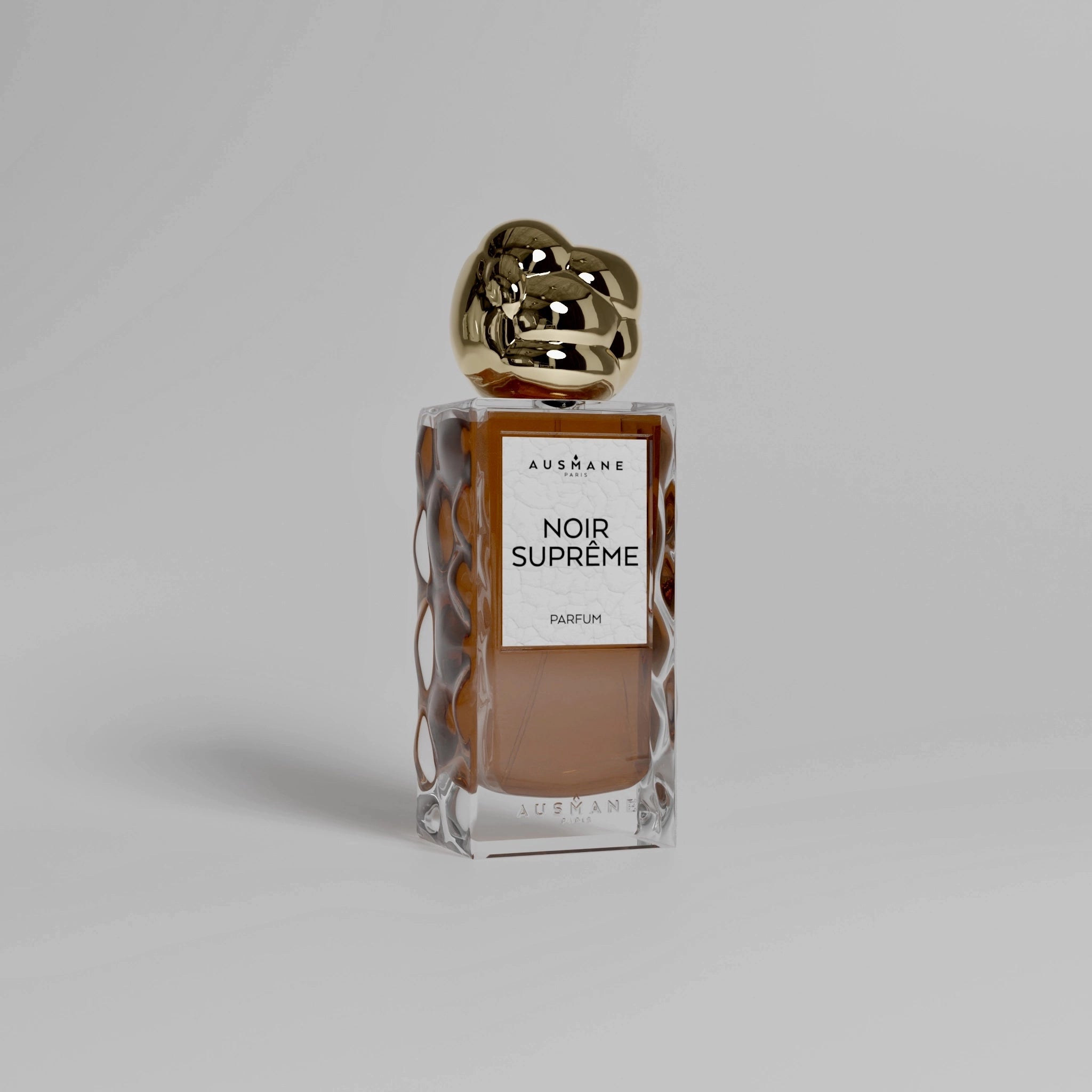 Parfum Noir Suprême - Fragrance épicée et mystérieuse aux notes de cardamome et cacao.